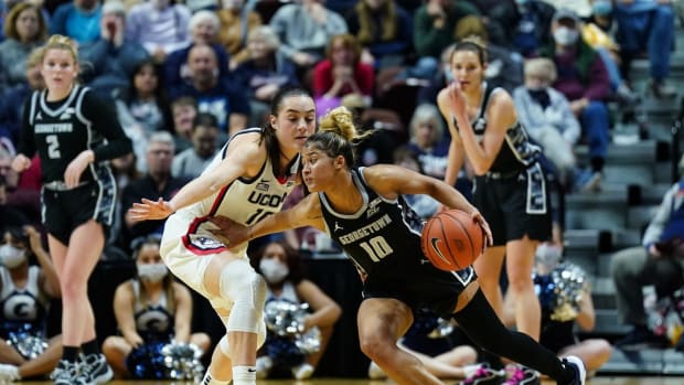 Mar 5, 2022; Uncasville, CT, USA; Georgetown Hoyas guard Kaylin West (10) drives the ball against UConn Huskies guard Nika Muhl (10) in the second half during the Big East Conference Tournament Quarterfinals at Mohegan Sun Arena. Mandatory Credit: David Butler II-USA TODAY Sports